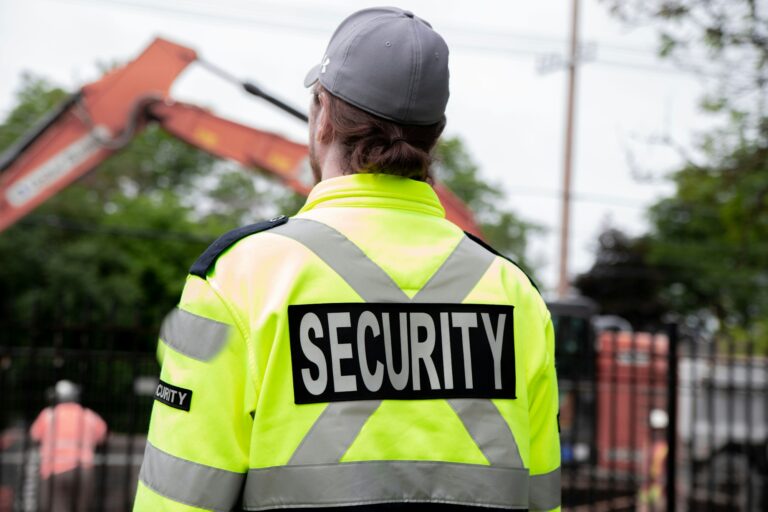 Security guard patrolling the street next to the construction area